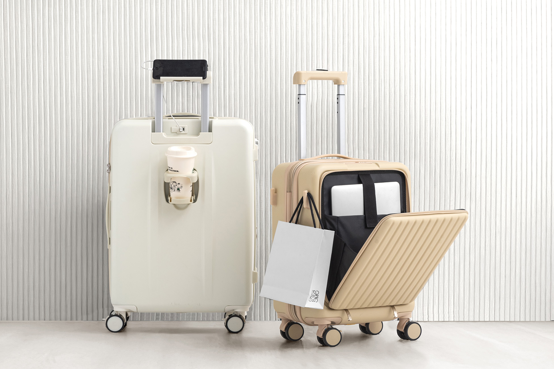 充電ポートやドリンクホルダー付きキャリーケースに新機能。容量拡張