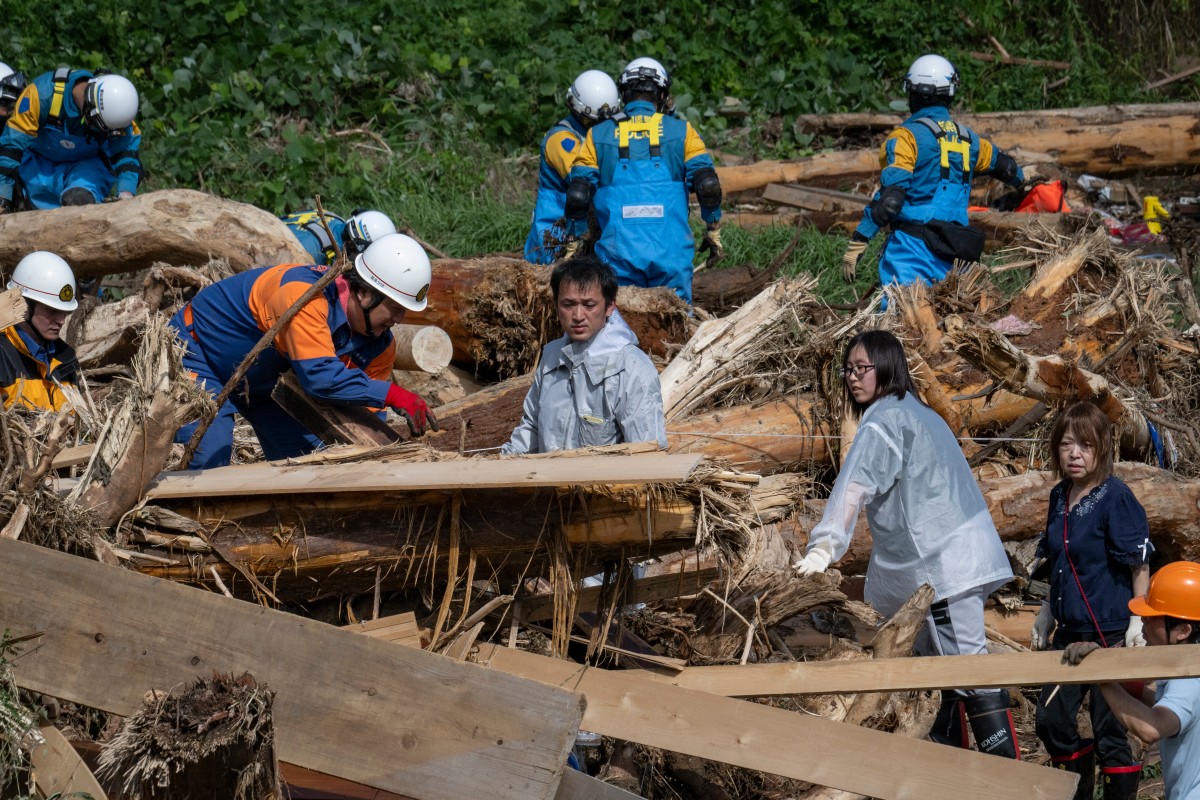 Rescuers comb muddy riverbanks after floods kill six in Japan