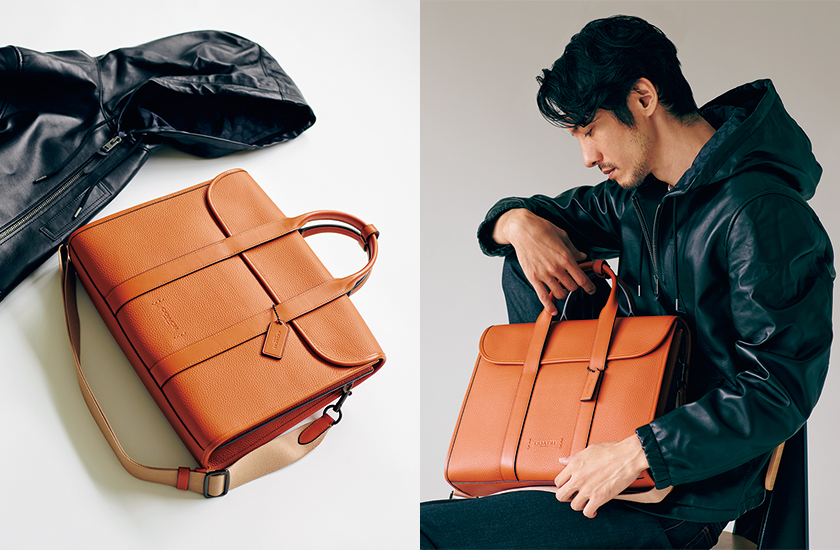 コーチの鮮烈な「オレンジバッグ」が秋冬の黒一張羅アウターを活かす話