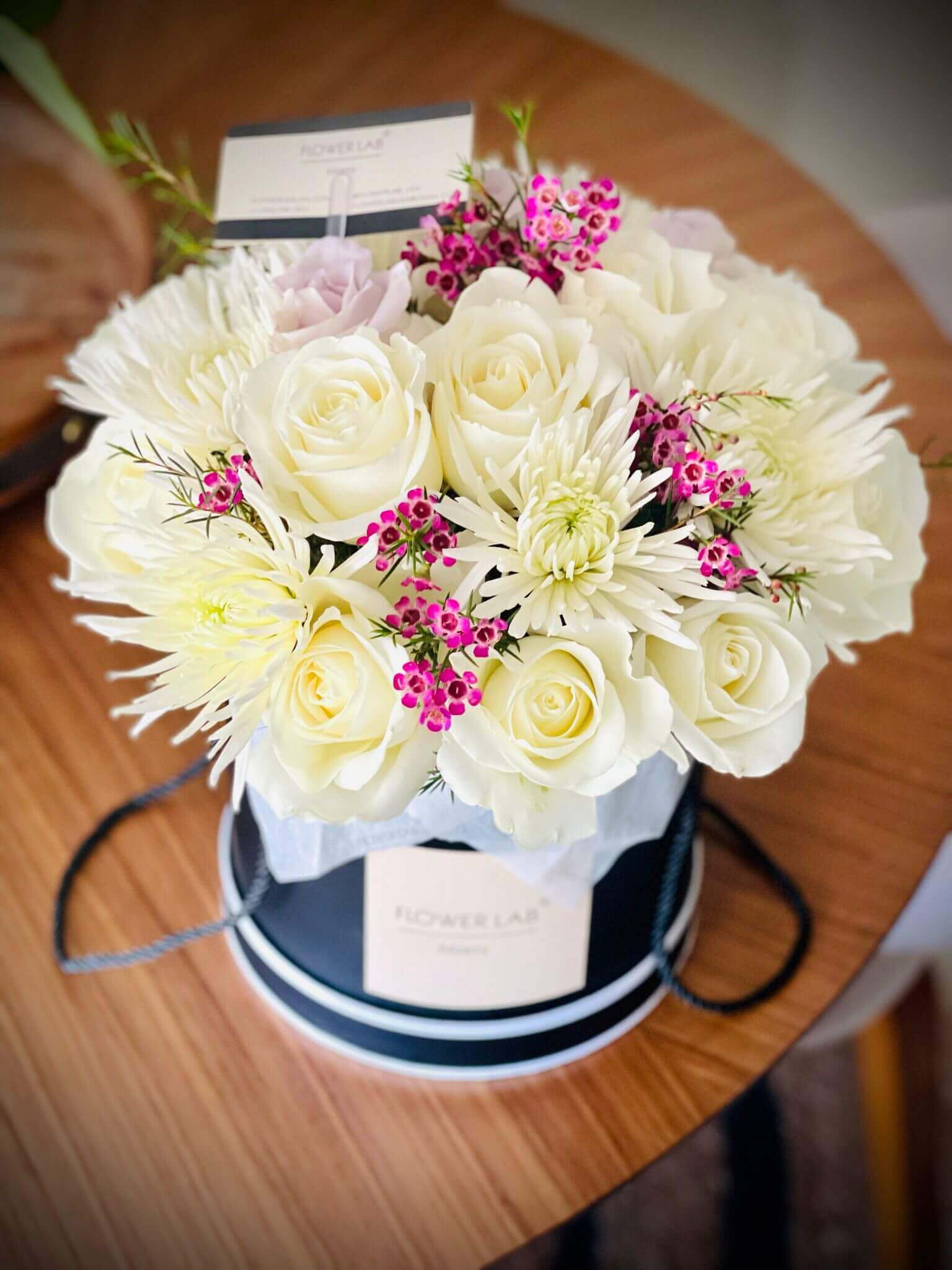 Sasha box with white roses, chrysanthemums and wax filler - Flower Lab