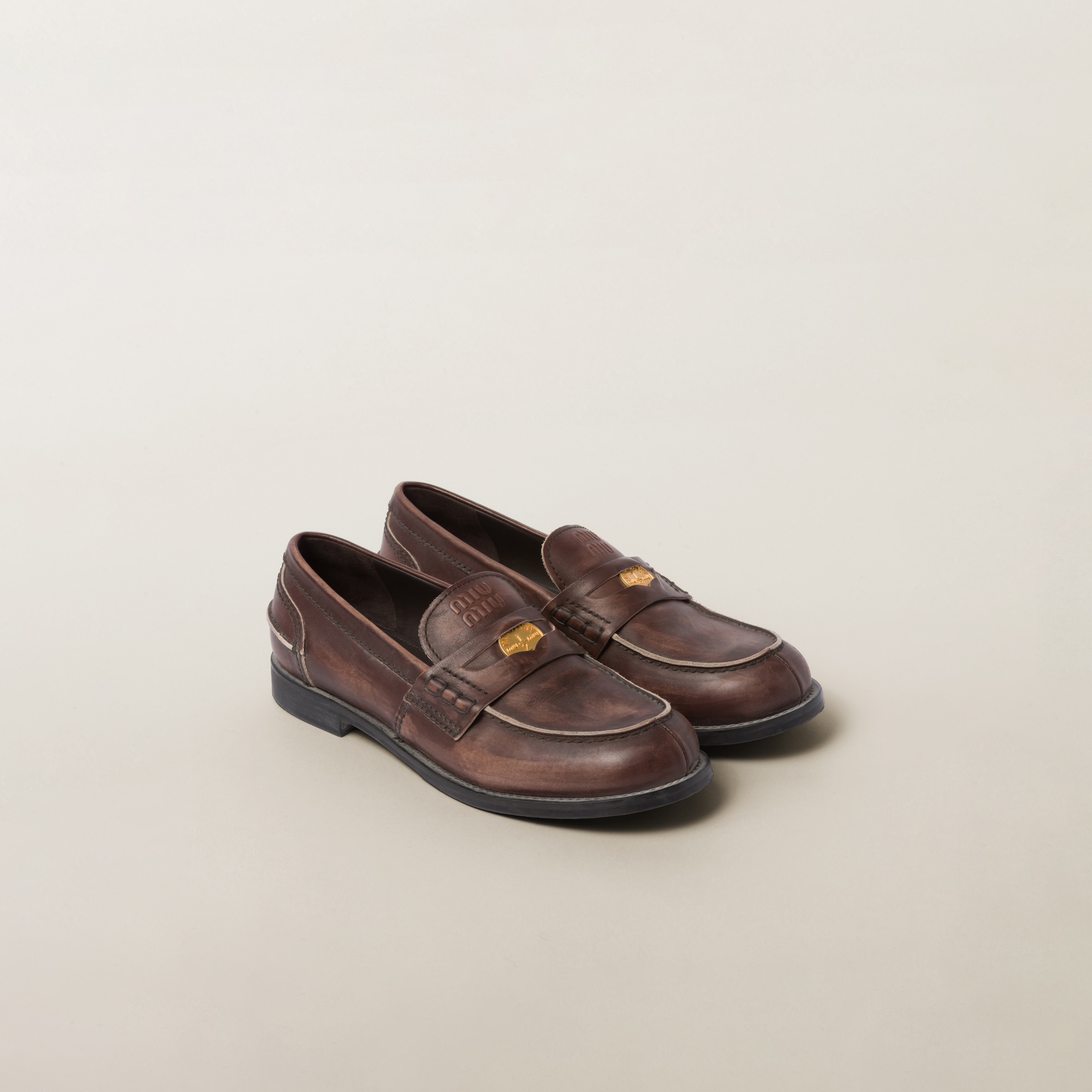 Ebony Vintage-effect Leather Penny Loafers | Miu Miu
