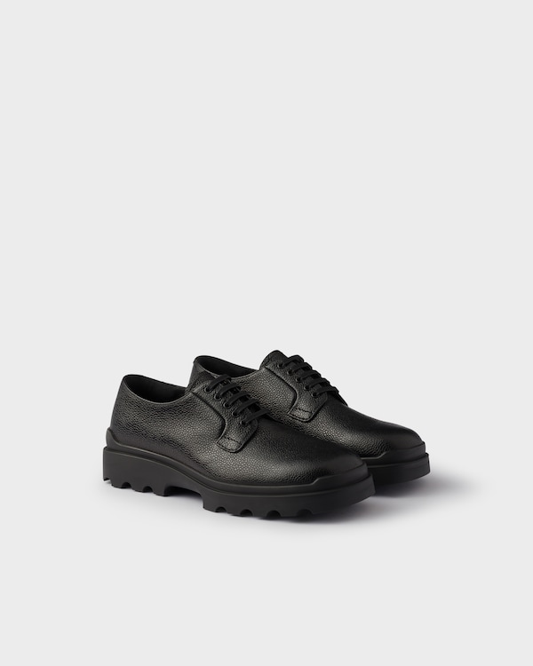 Black Stamped Leather Derby Shoes | PRADA