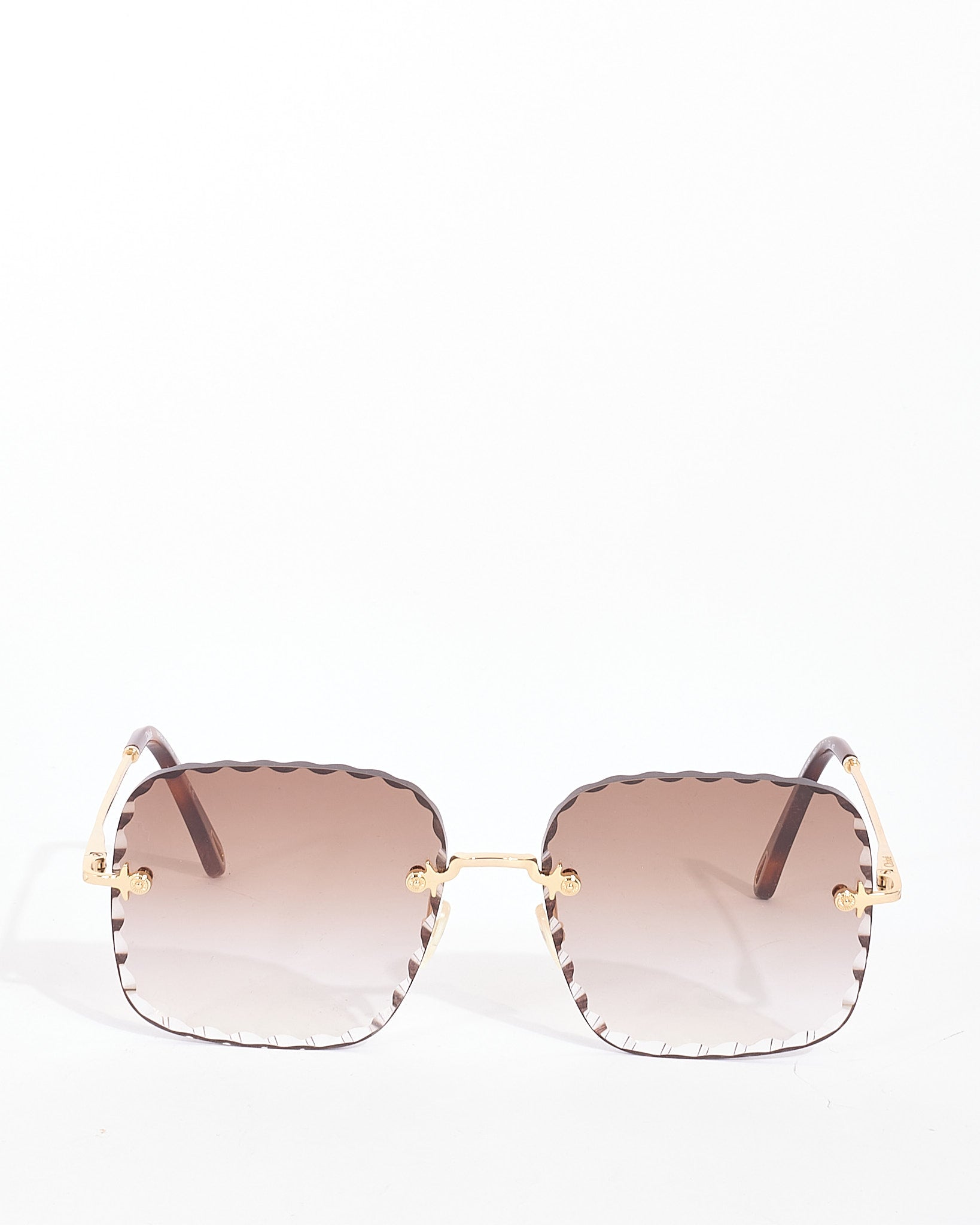 Explore a Chloé Gold Metal Rimless CE161S Rosie Sunglasses
