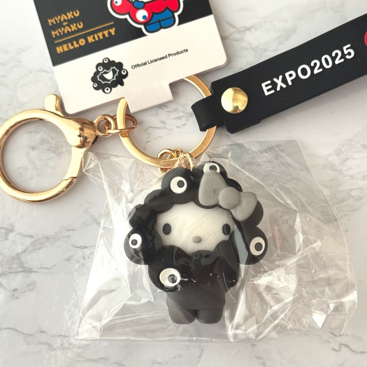 関西万博会場限定 黒ミャクミャク なりきりキーホルダー キティ 黒