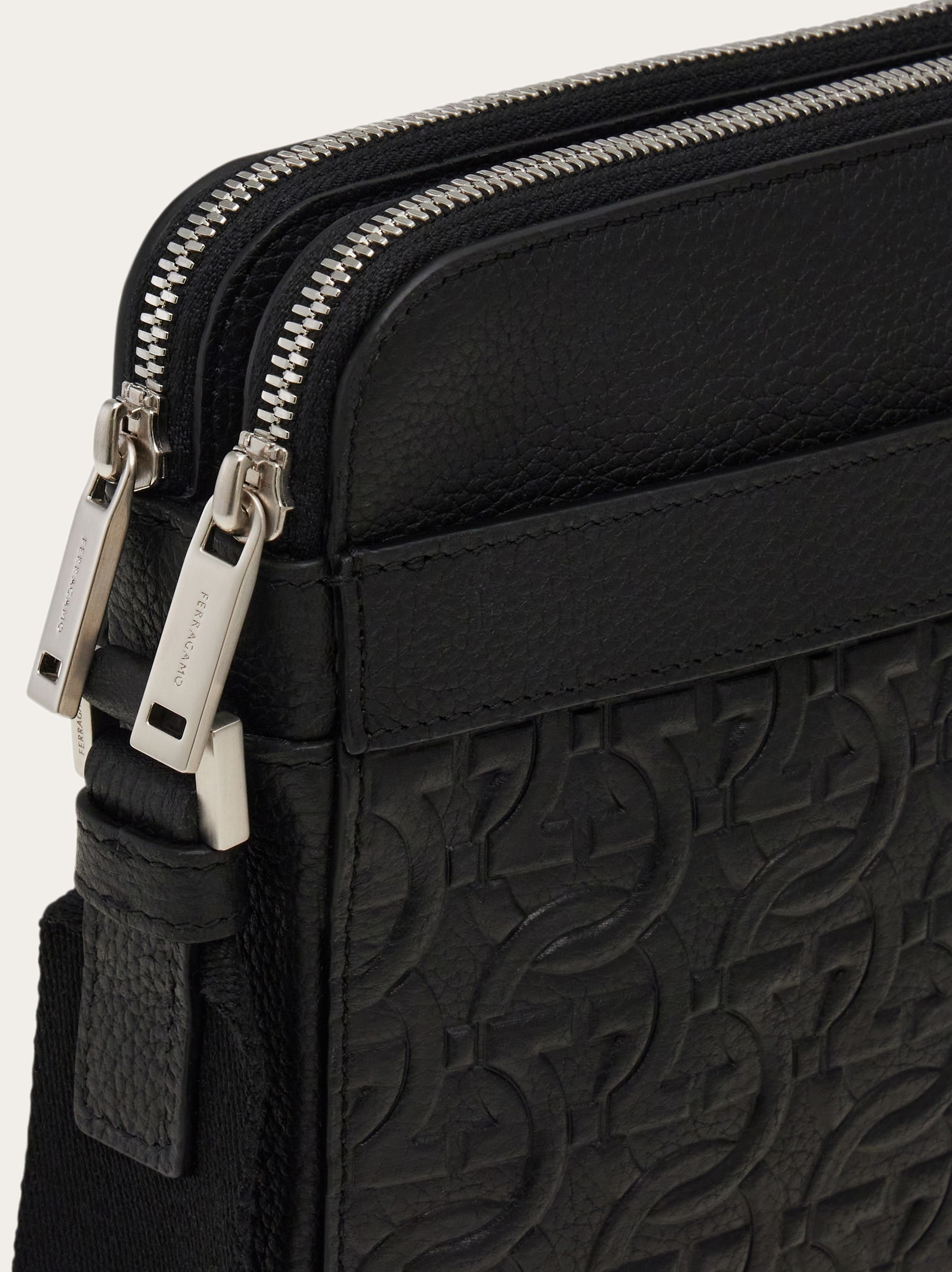 Embossed Gancini crossbody bag - Men | Ferragamo
