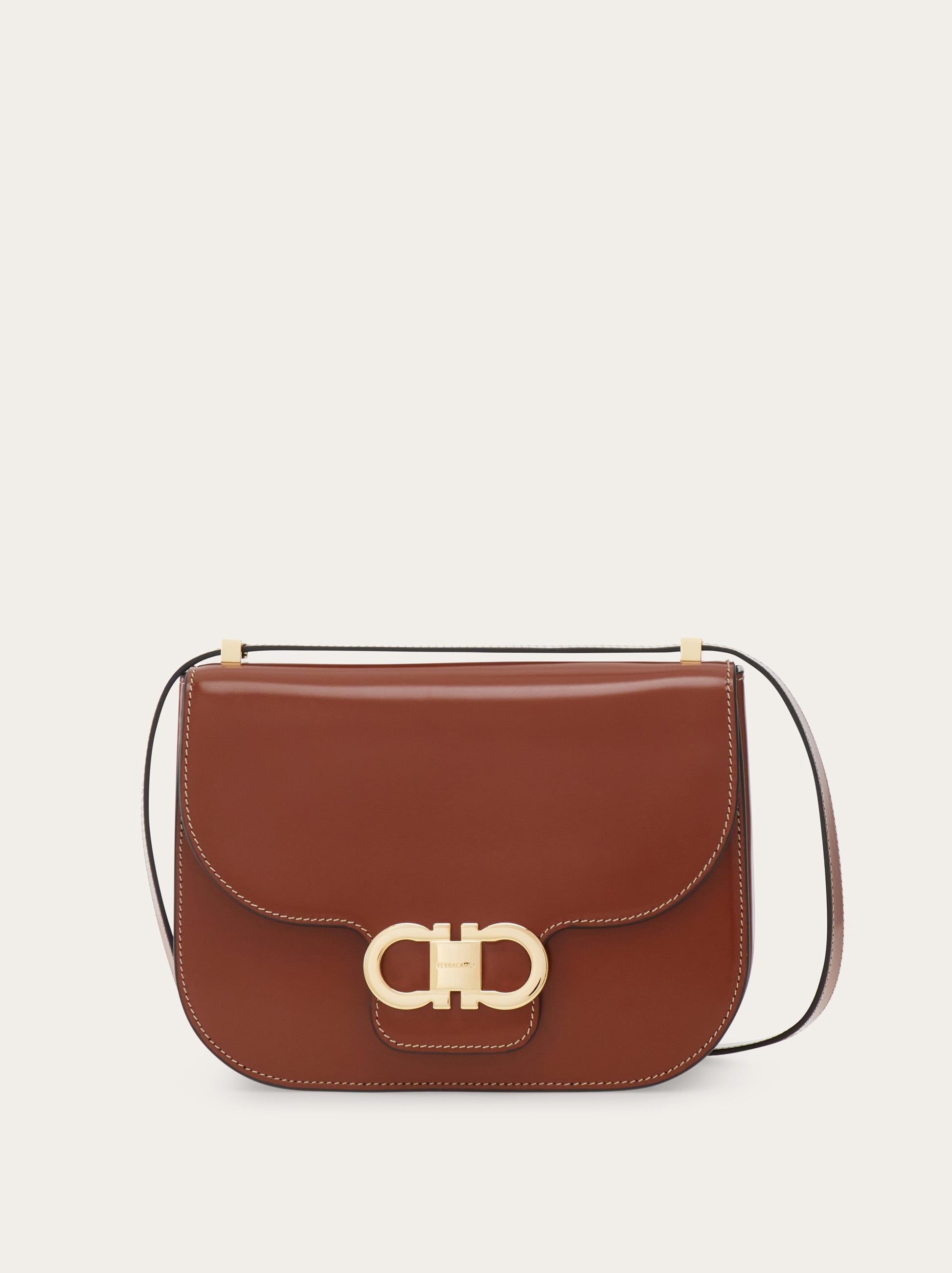 Double Gancini North-South crossbody bag - Women | Ferragamo