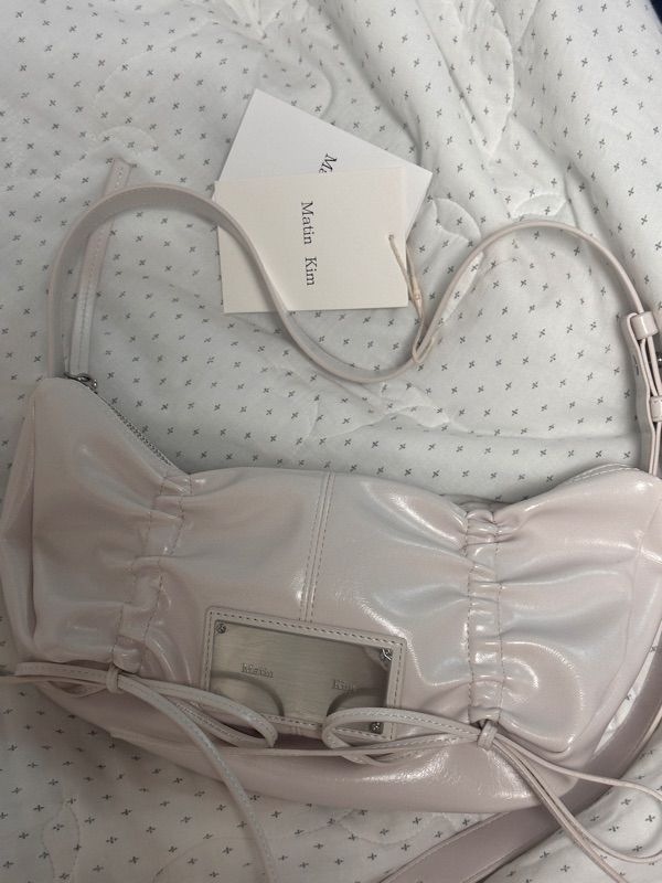 MUSINSA | MATIN KIM HALF SHIRRING RIBBON ROUND BAG IN IVORY