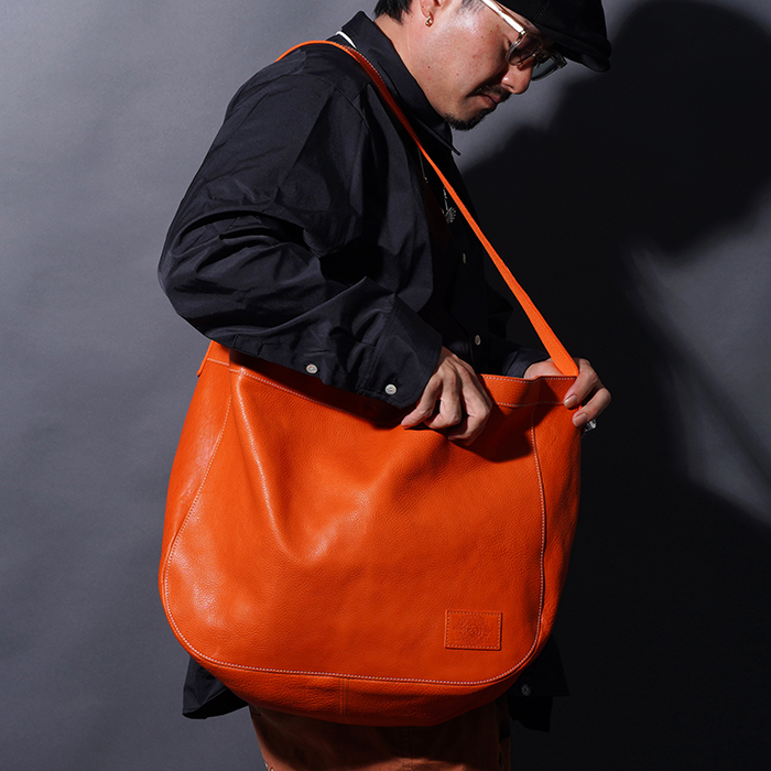 AWA-250602 /「LEATHER NEWS PAPER BAG / ORANGE」レザーニュース
