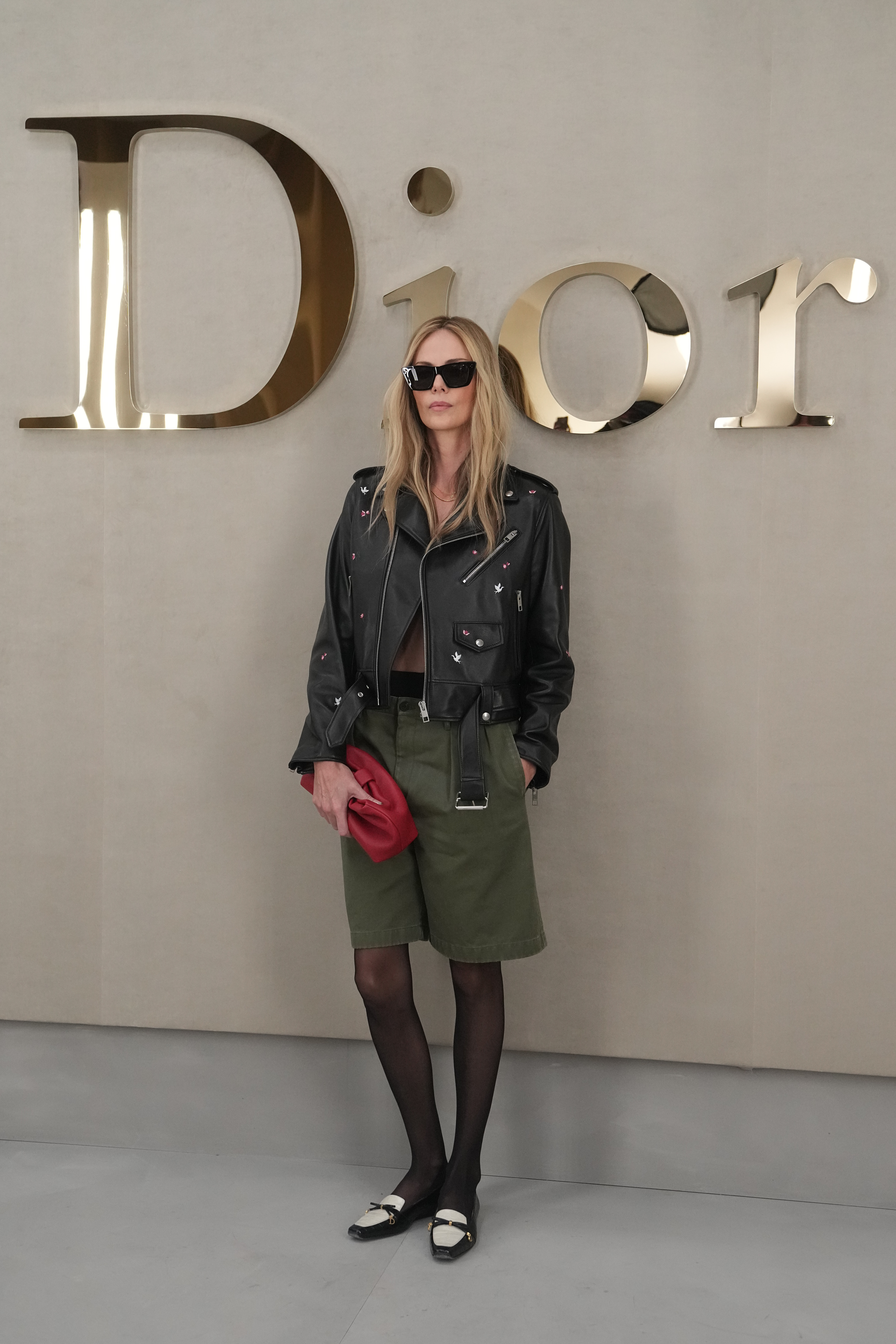 Charlize Theron wears shirtless look with shorts and tights at