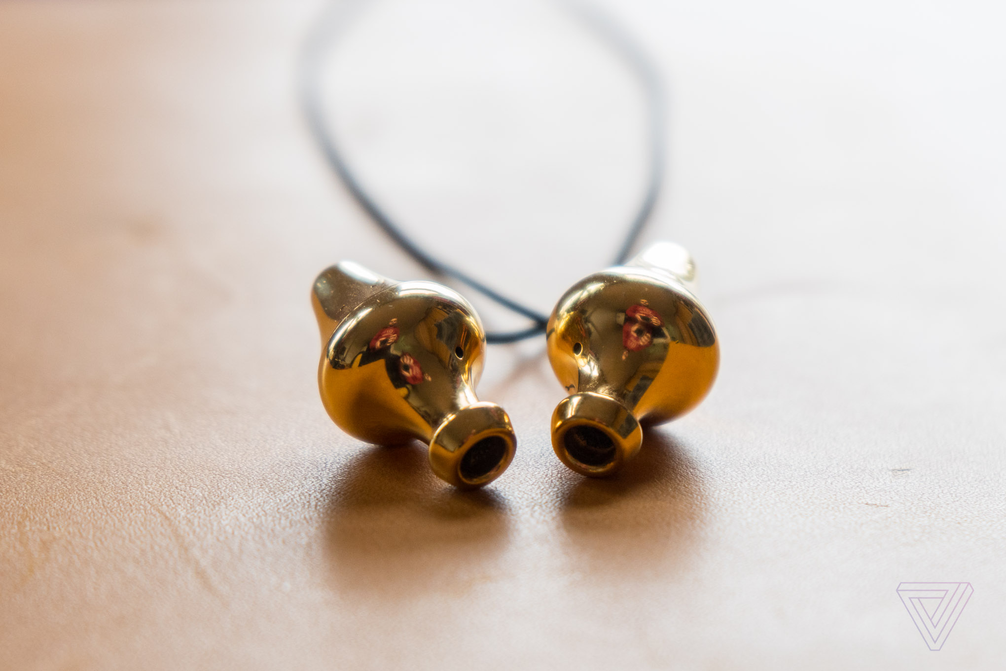 These golden headphones were crafted by a mad genius | The Verge