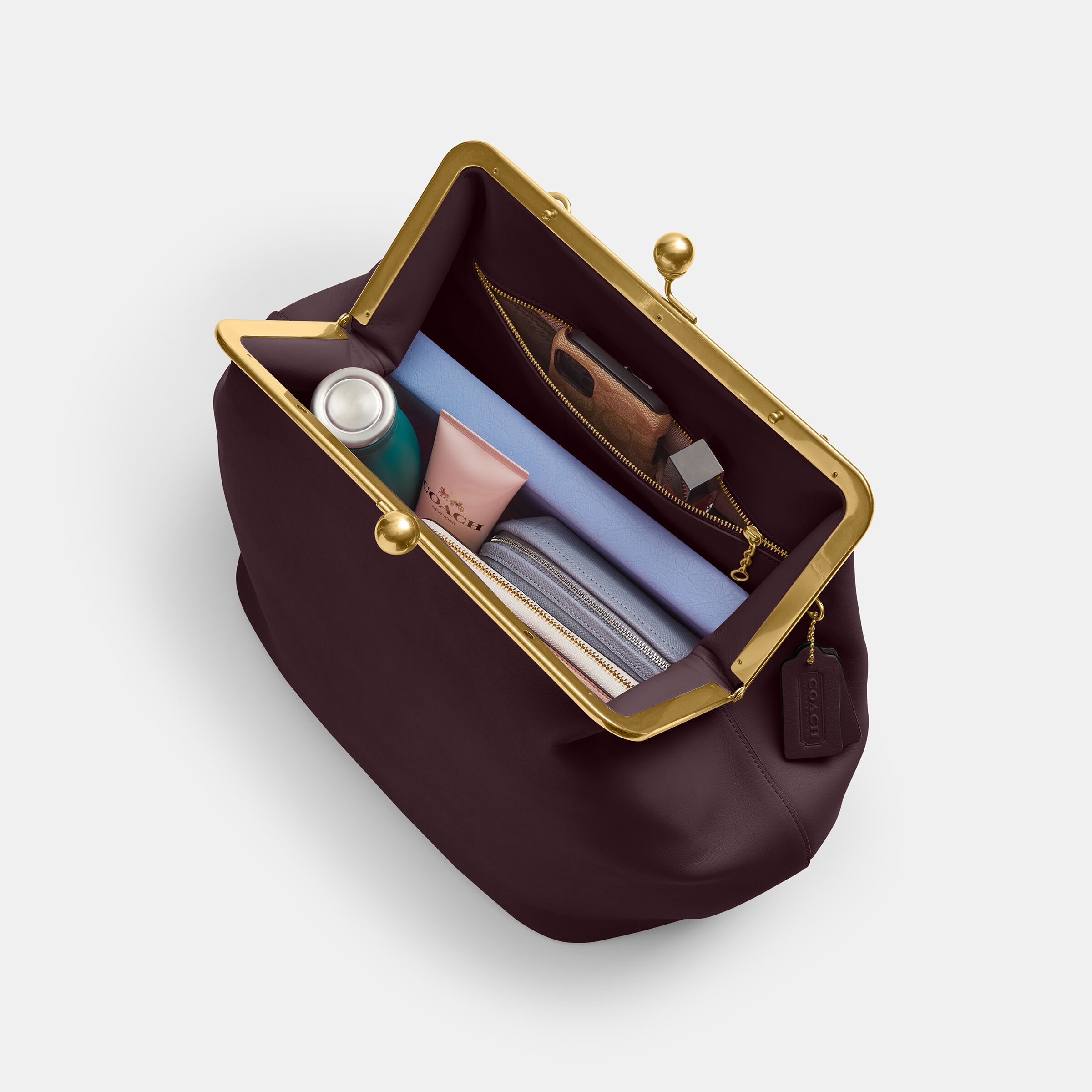 Buy COACH Large Kisslock Frame Bag Dark Purple Online in UAE