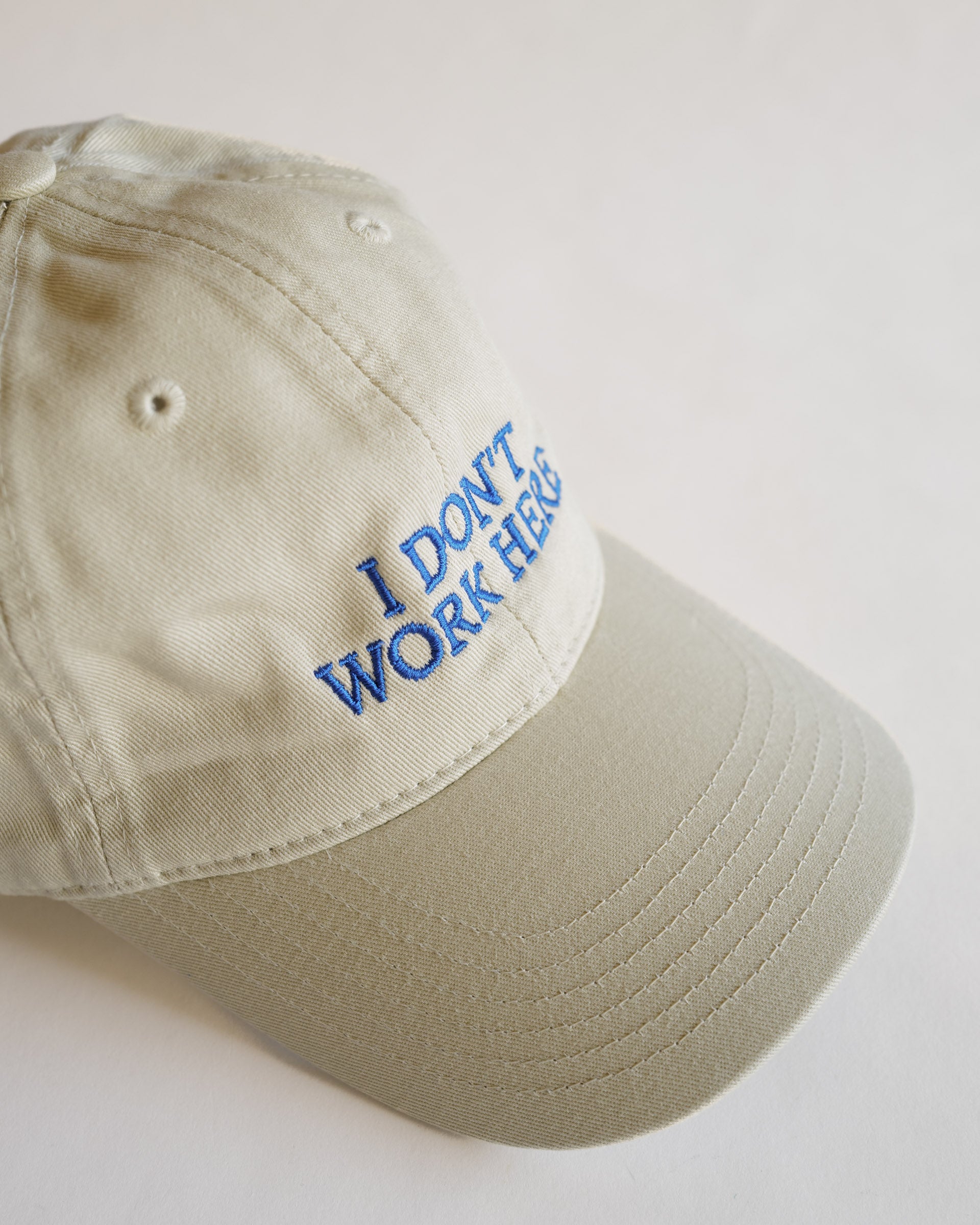 IDEA Books Sorry I Don't Work Here Hat (Cream) – SORT