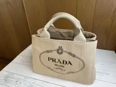 2026年最新】prada カナパ ベージュの人気アイテム - メルカリ