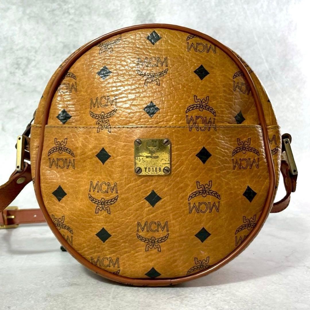 超希少レア　MCM タンバリン　タッセル　ショルダーバッグ ボディバッグ　総柄 エムシーエムヘリテージ ヴィセトスタンバリンバッグ コニャック
