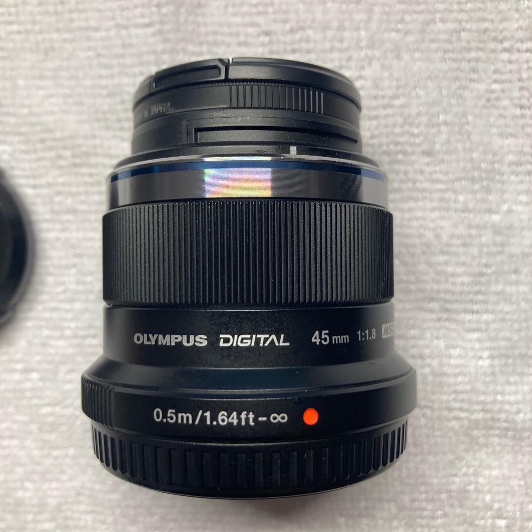 M.ZUIKO DIGITAL 45mm F1.8 保護フィルタ/予備キャップ付 Amazon.com : Lens Cap Cover Keeper Protector for Olympus M.Zuiko