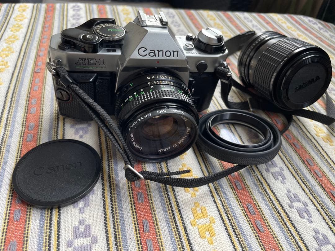 CANON AE-1 PROGRAM　50ｍｍ　グリップ、シグマzoomレンズ付 Canon AE-1 PROGRAM (Black) + New FD 50mm F1.8 – 東京CAMERA